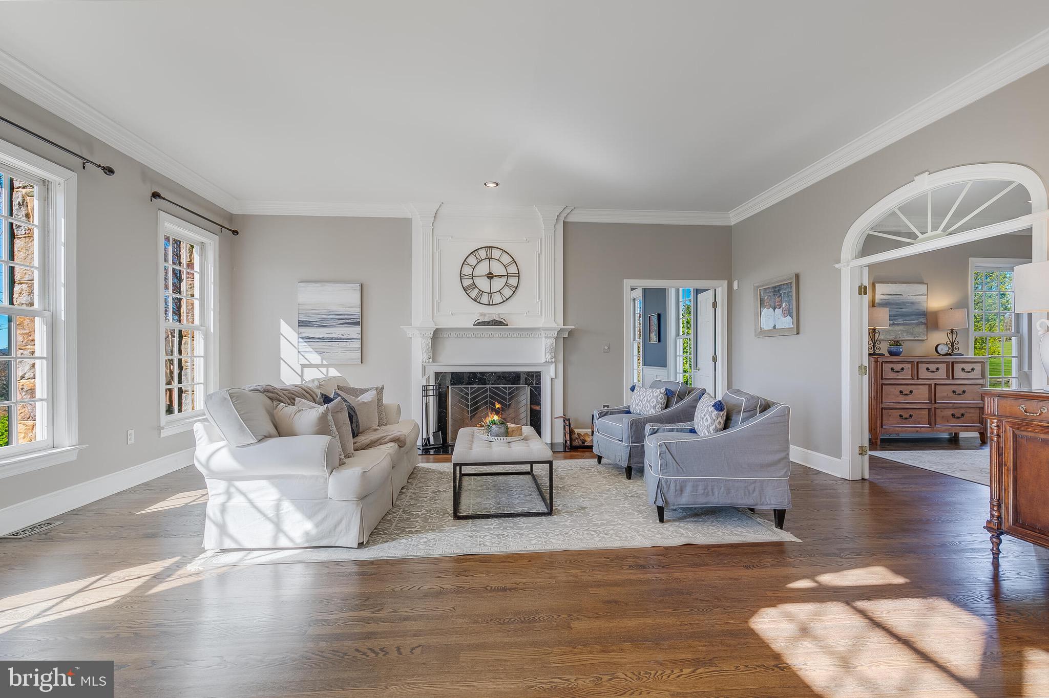 15140 Loyalty Road Waterford, VA 20197 - Photo 21 of 60 a living room with fireplace furniture and a large window