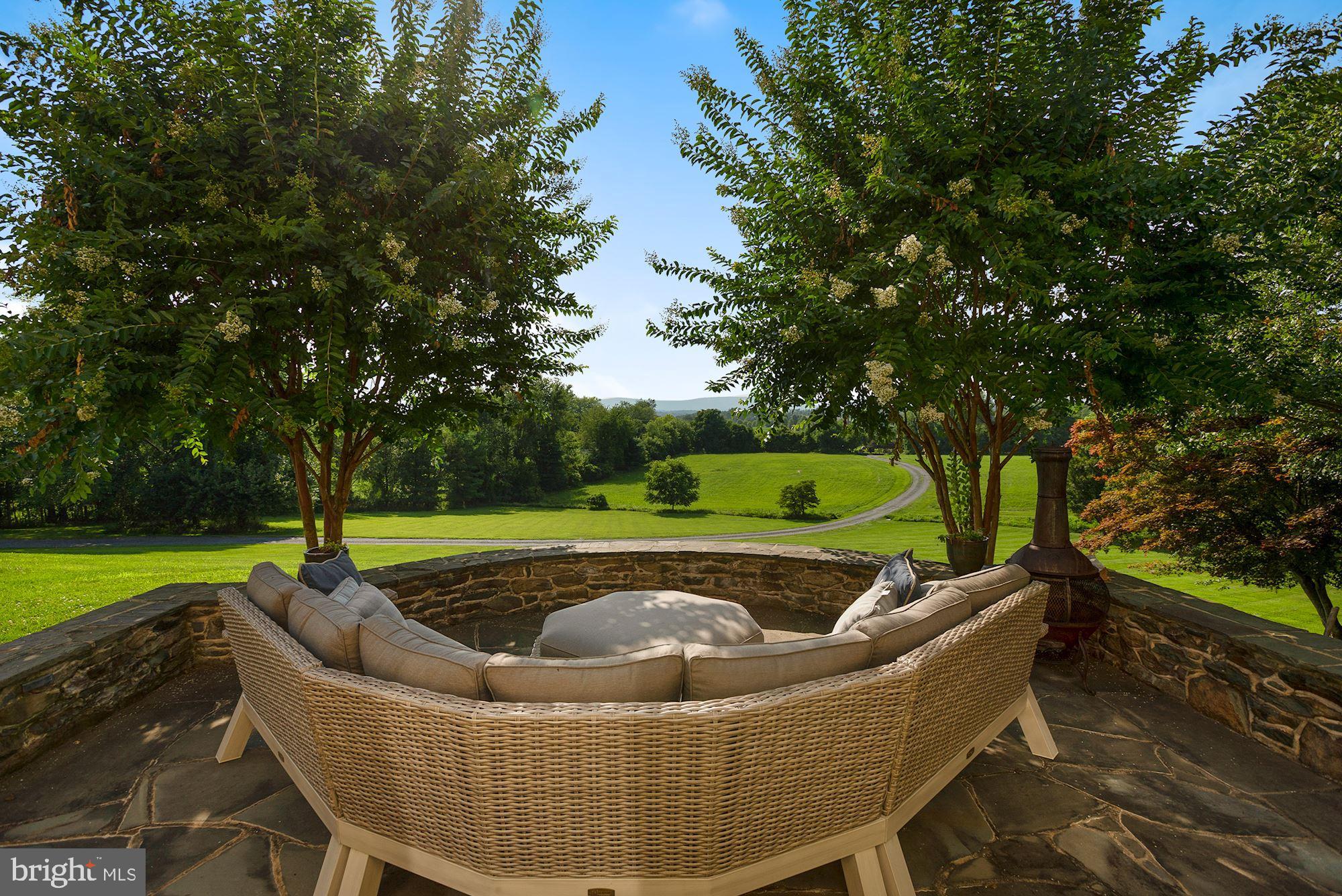 15140 Loyalty Road Waterford, VA 20197 - Photo 26 of 60 a view of a swimming pool with a patio