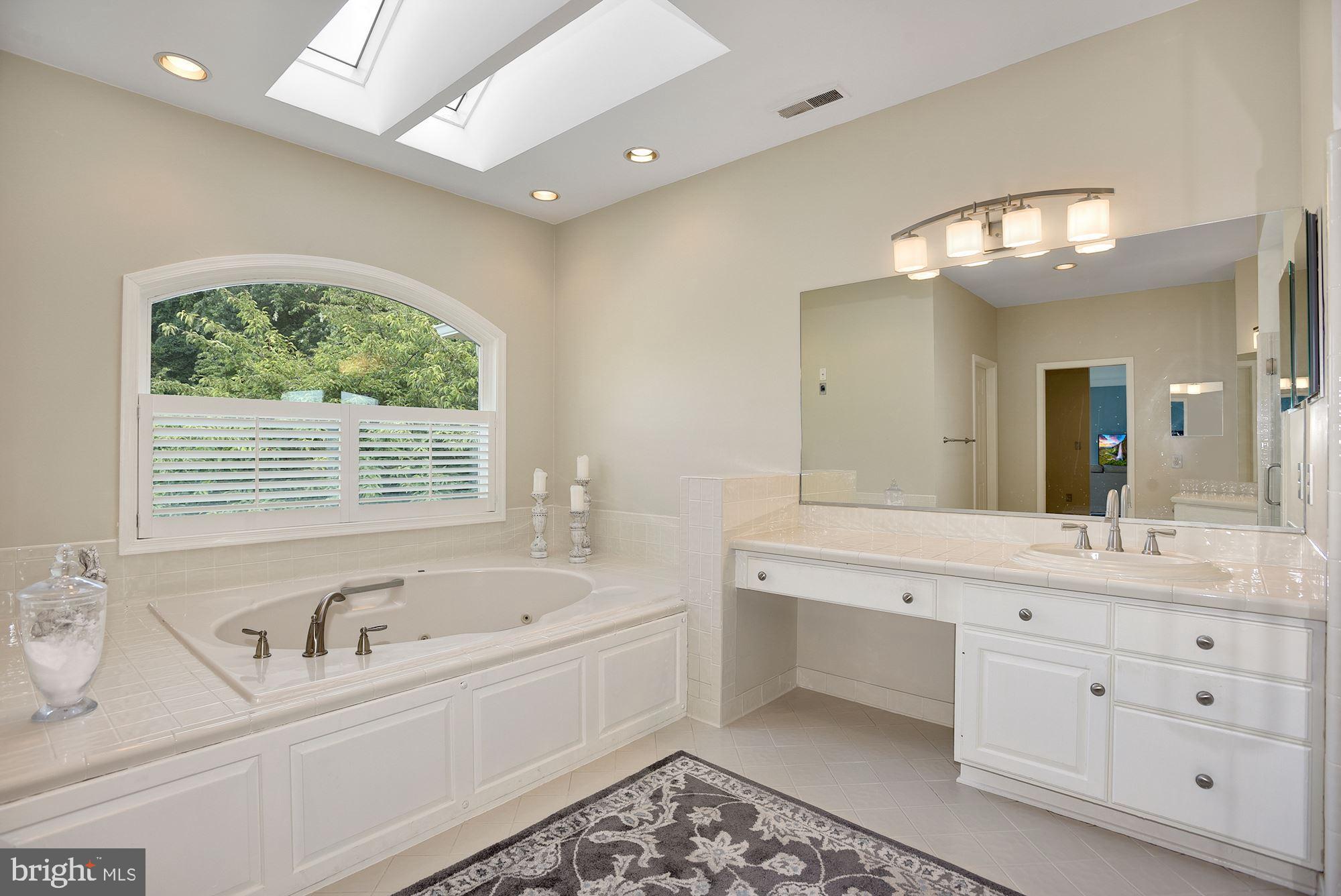 15140 Loyalty Road Waterford, VA 20197 - Photo 34 of 60 Large primary bathroom with sunlight, 2 vanities
