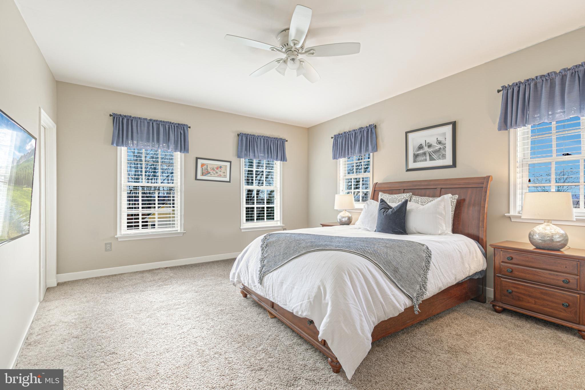 15140 Loyalty Road Waterford, VA 20197 - Photo 37 of 60 a spacious bedroom with a bed and two windows