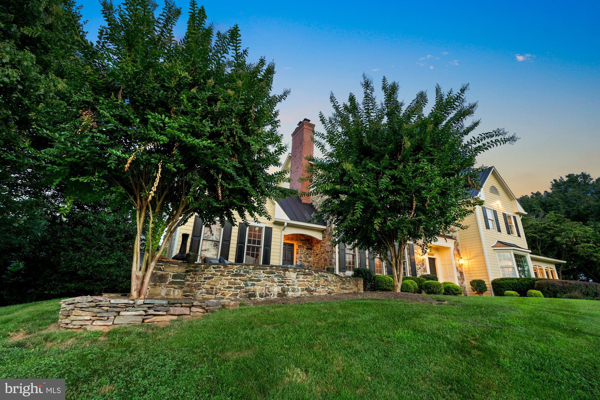 15140 Loyalty Road Waterford, VA 20197 - Photo 45 of 60 a front view of a house with a garden