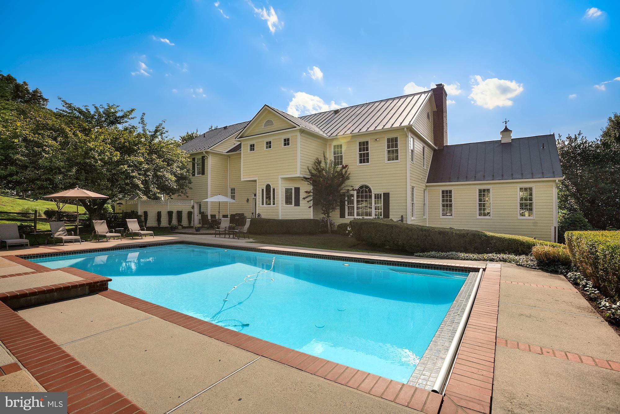 15140 Loyalty Road Waterford, VA 20197 - Photo 55 of 60 a view of a house with a swimming pool