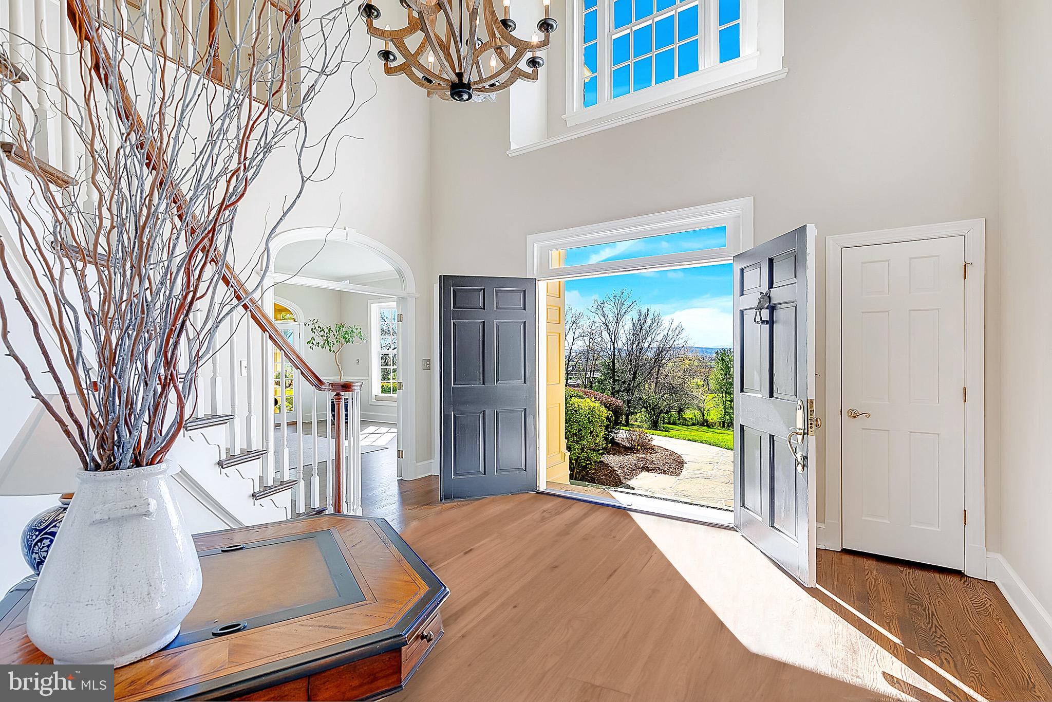 15140 Loyalty Road Waterford, VA 20197 - Photo 9 of 60 a very nice looking room with a large window and a chandelier