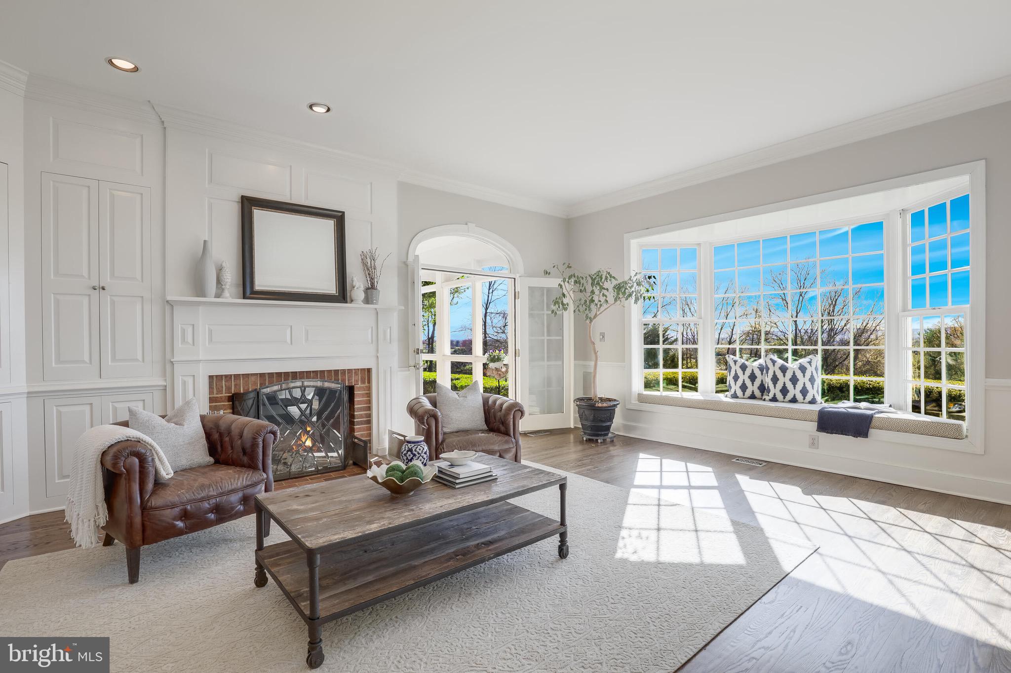 15140 Loyalty Road Waterford, VA 20197 - Photo 10 of 60 a living room with furniture and a fireplace