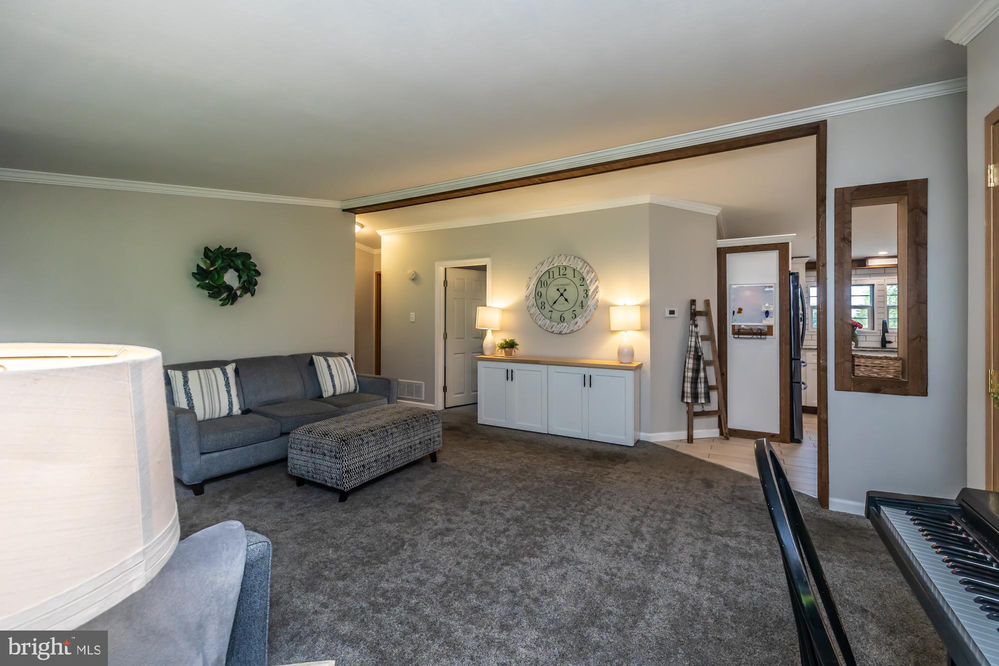 239 Quarry Road Gap, PA 17527 - Photo 11 of 48 a living room with furniture and a mirror