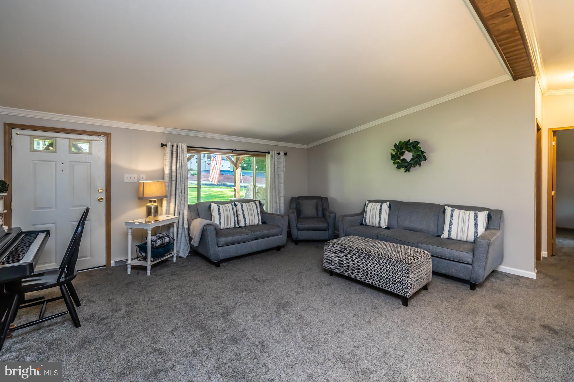 239 Quarry Road Gap, PA 17527 - Photo 12 of 48 a living room with furniture and a window