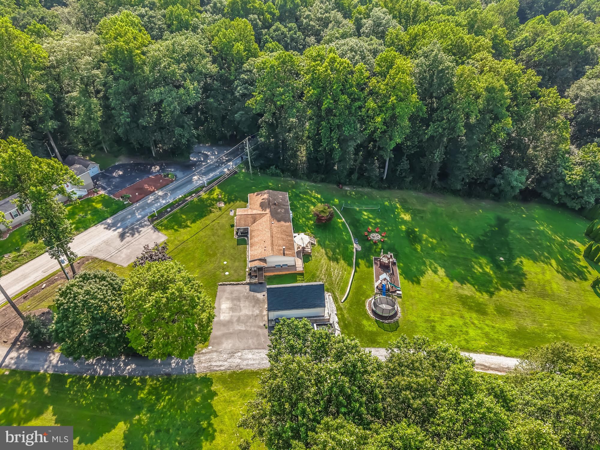 239 Quarry Road Gap, PA 17527 - Photo 2 of 48 an aerial view of a house with swimming pool a yard and patio