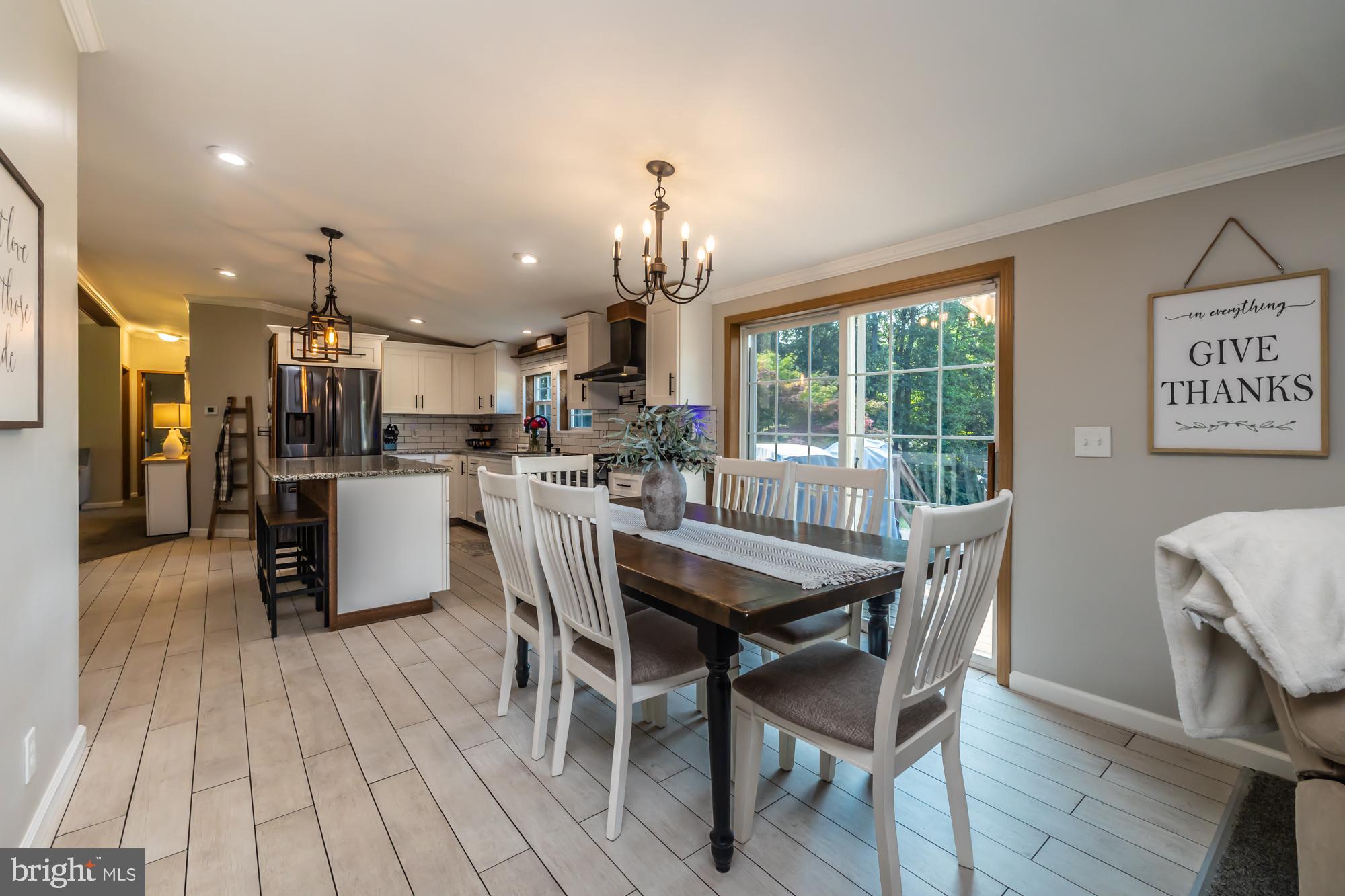 239 Quarry Road Gap, PA 17527 - Photo 21 of 48 a dining room with furniture and a chandelier