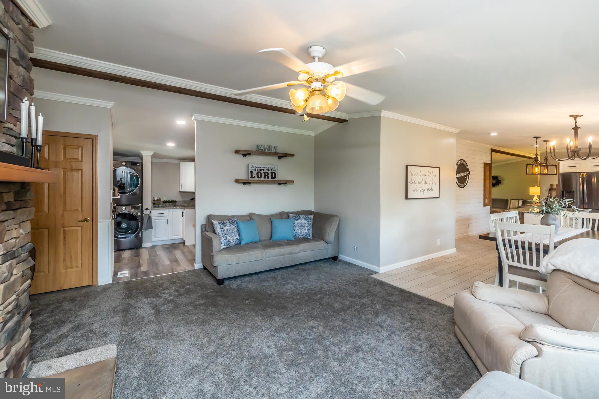 239 Quarry Road Gap, PA 17527 - Photo 24 of 48 a living room with furniture and a chandelier