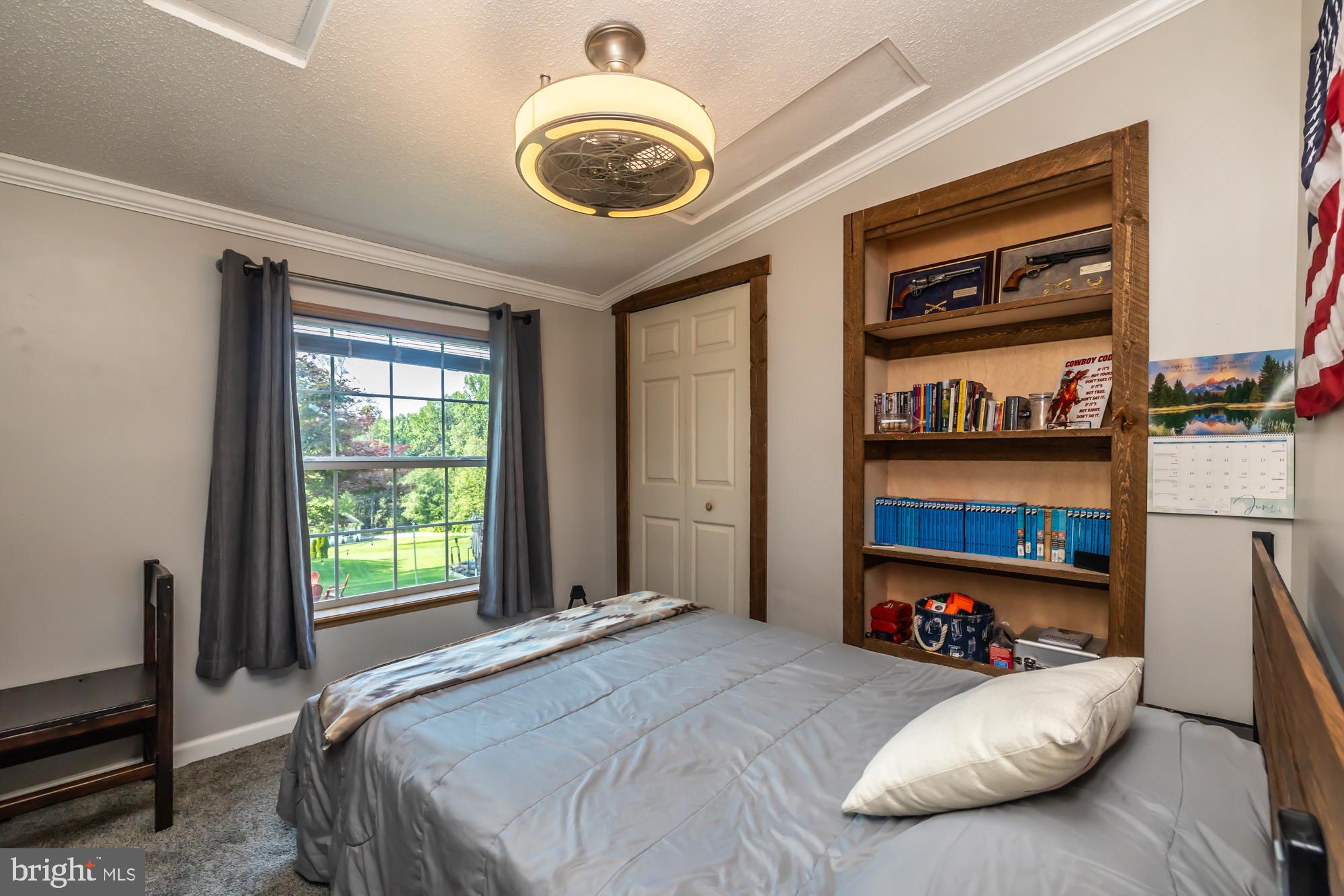 239 Quarry Road Gap, PA 17527 - Photo 32 of 48 a bedroom with a bed and a large window