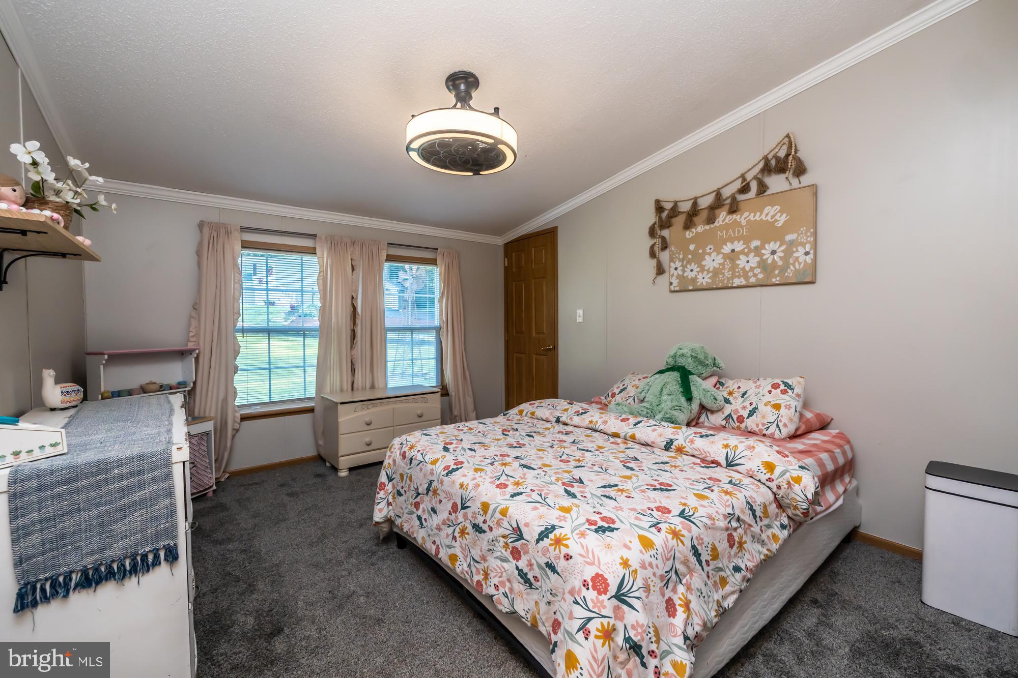 239 Quarry Road Gap, PA 17527 - Photo 35 of 48 a bedroom with a large bed and a window