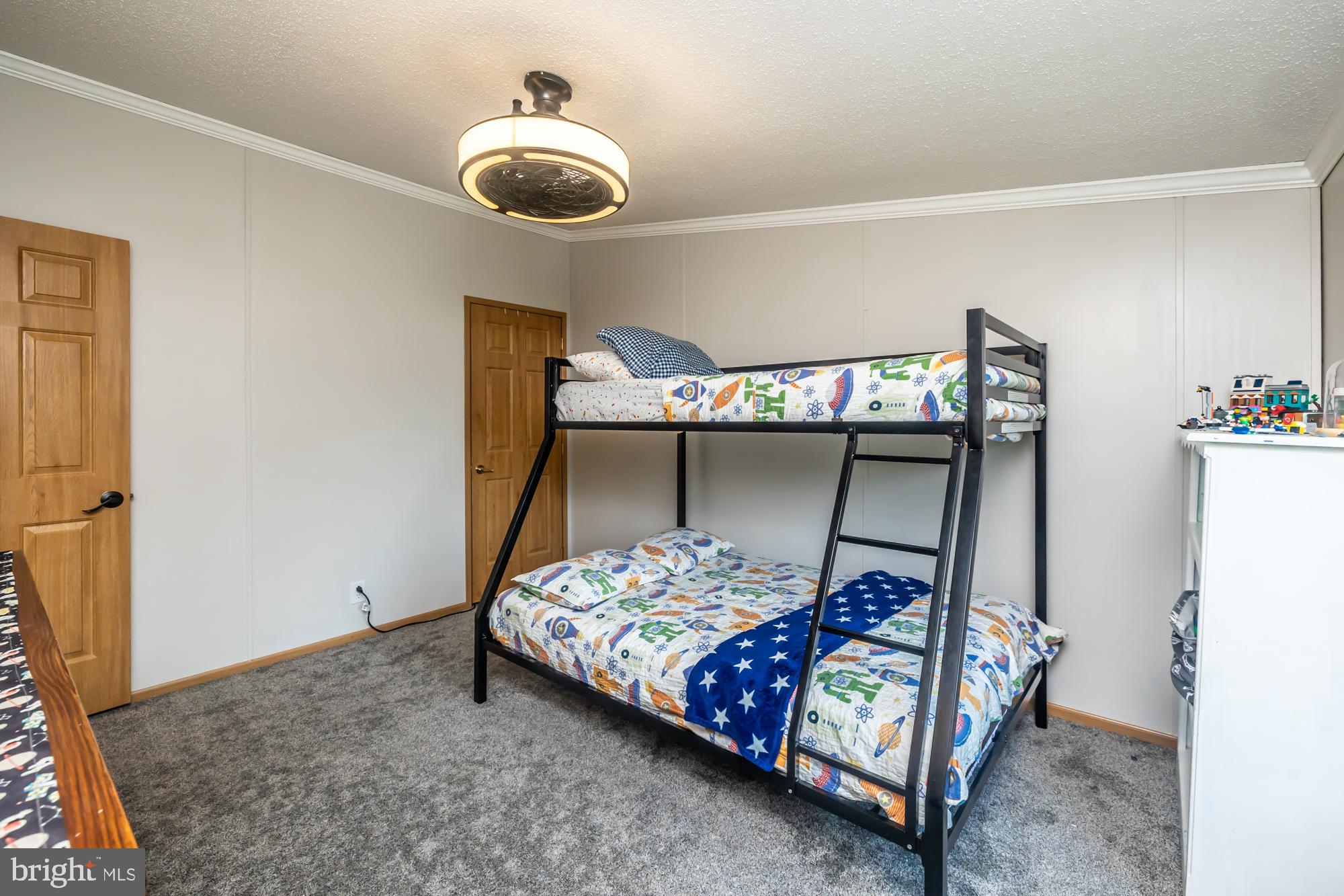 239 Quarry Road Gap, PA 17527 - Photo 41 of 48 a bedroom with a bed and a chandelier