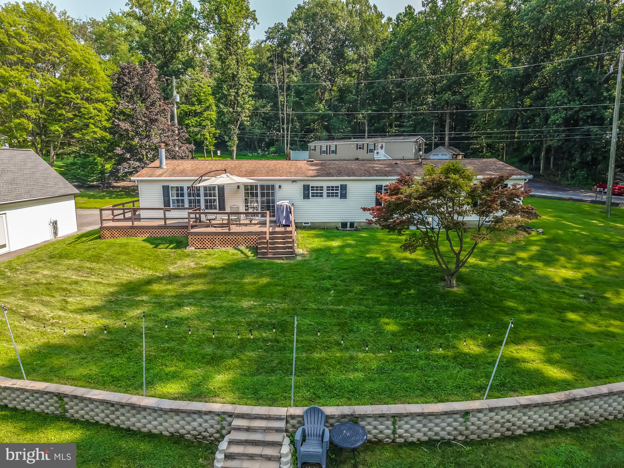 239 Quarry Road Gap, PA 17527 - Photo 47 of 48 a view of a house with a backyard porch and sitting area