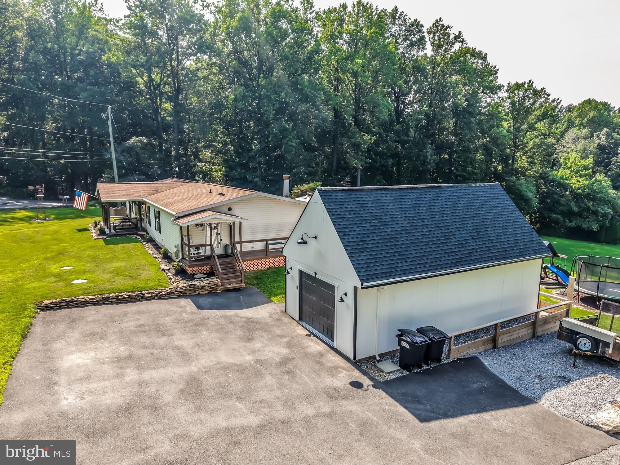 239 Quarry Road Gap, PA 17527 - Photo 9 of 48 an aerial view of a house with swimming pool and large trees