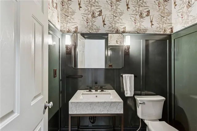 a bathroom with a sink and toilet