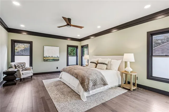 a spacious bedroom with a large bed and a window