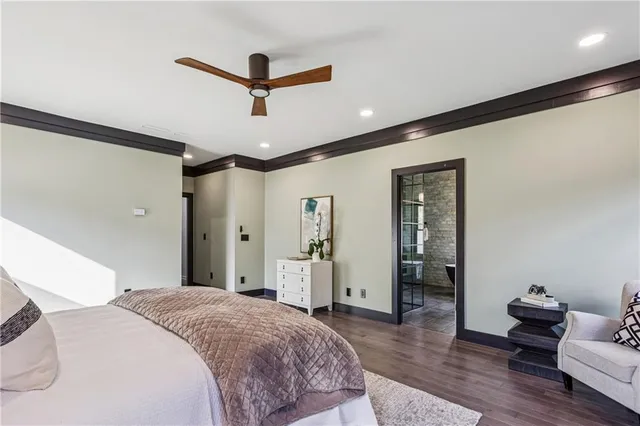 a spacious bedroom with a bed and furniture