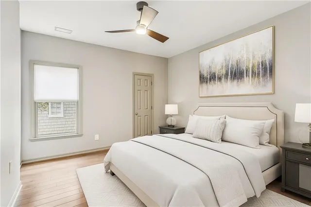 a bedroom with a large bed and a window