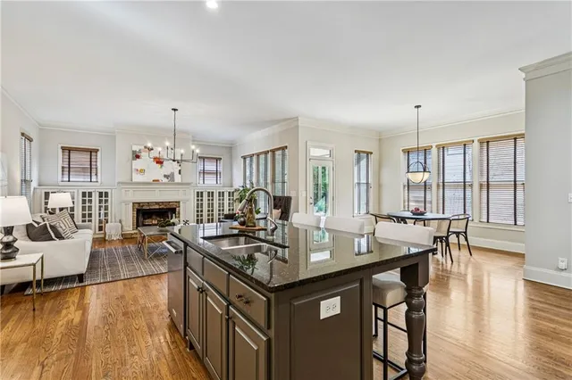 a view of a dining room with furniture wooden floor and chandelier