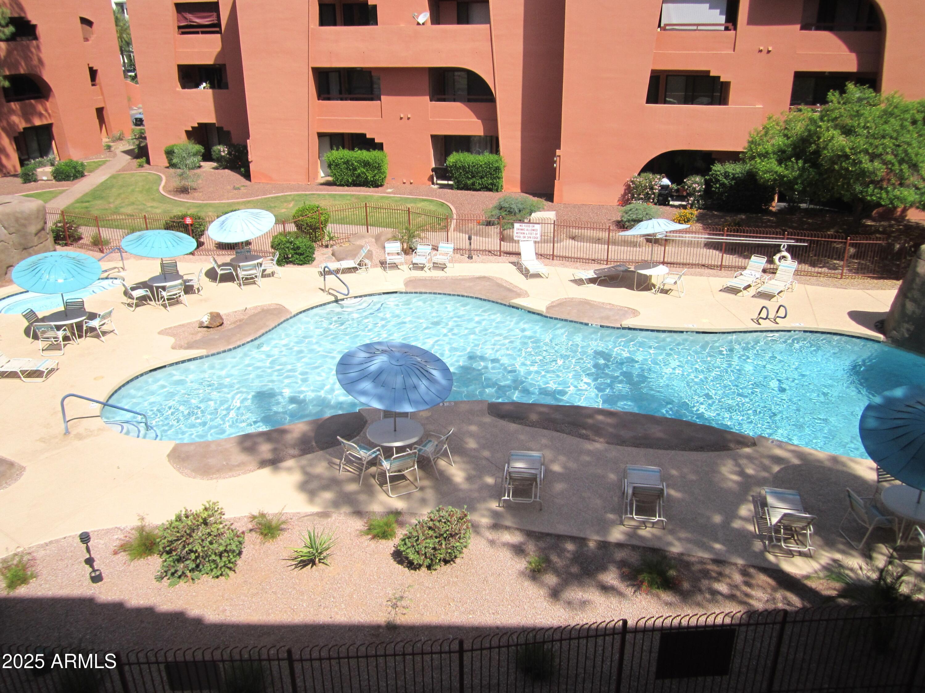 12222 North Paradise Village Parkway West, Unit 325 Phoenix, AZ 85032 - Photo 14 of 28 an aerial view of residential houses with outdoor space