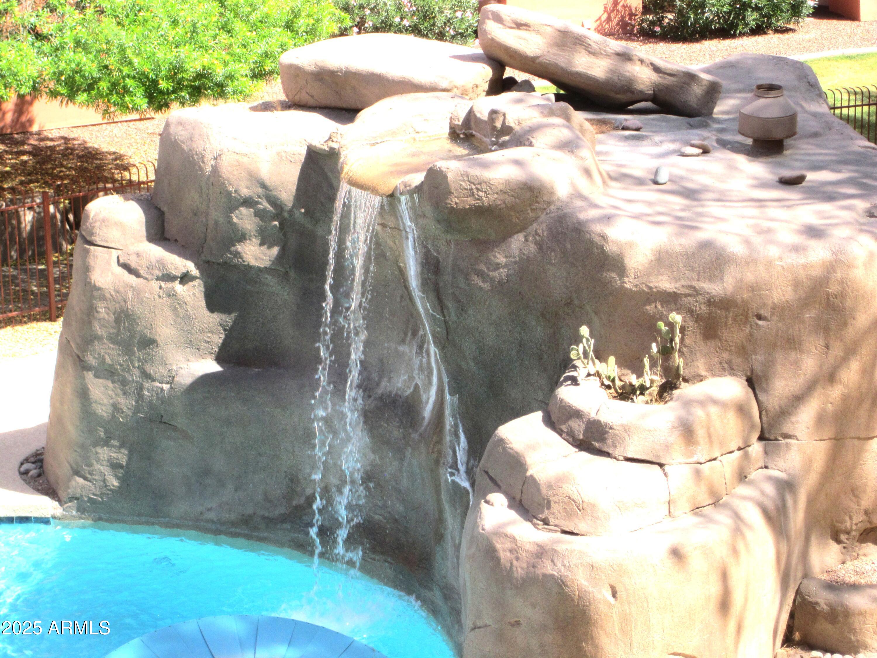 12222 North Paradise Village Parkway West, Unit 325 Phoenix, AZ 85032 - Photo 2 of 28 a view of table and chair