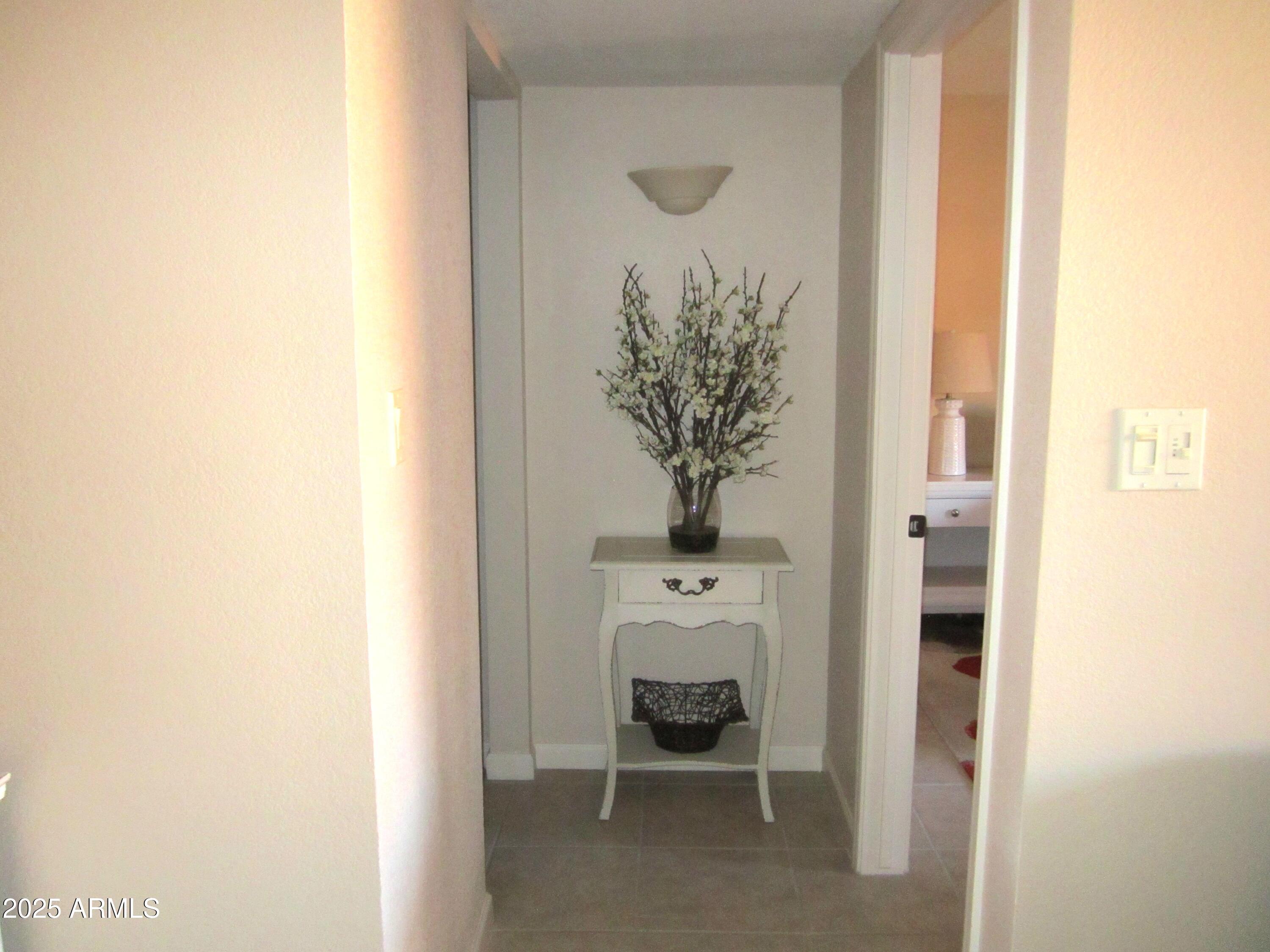 12222 North Paradise Village Parkway West, Unit 325 Phoenix, AZ 85032 - Photo 8 of 28 a view of a hallway with seating area