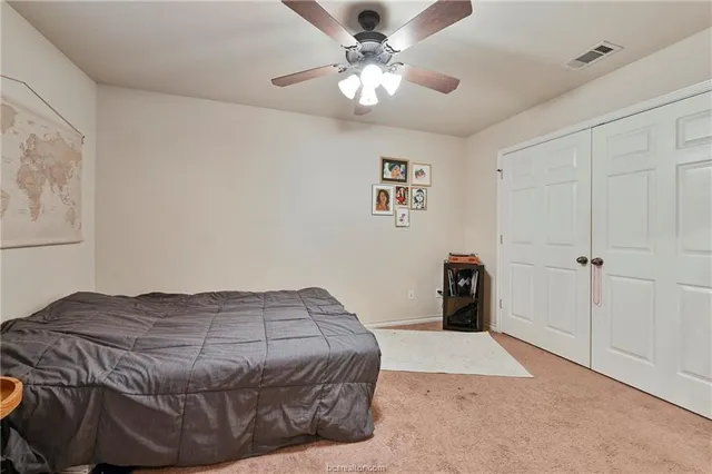 a bathroom with a toilet a sink and a mirror