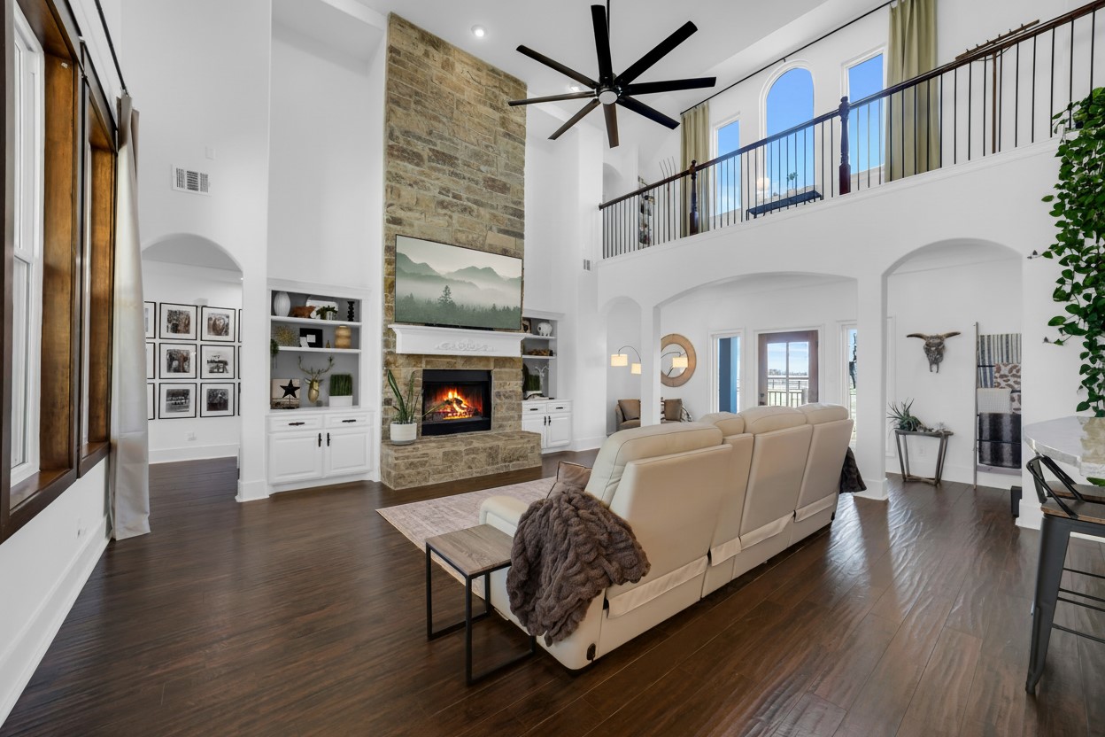 3103 Brundrett Road Wallis, TX 77485 - Photo 9 of 50 Another angle of the open living area with high ceilings, fireplace, and abundant natural light.