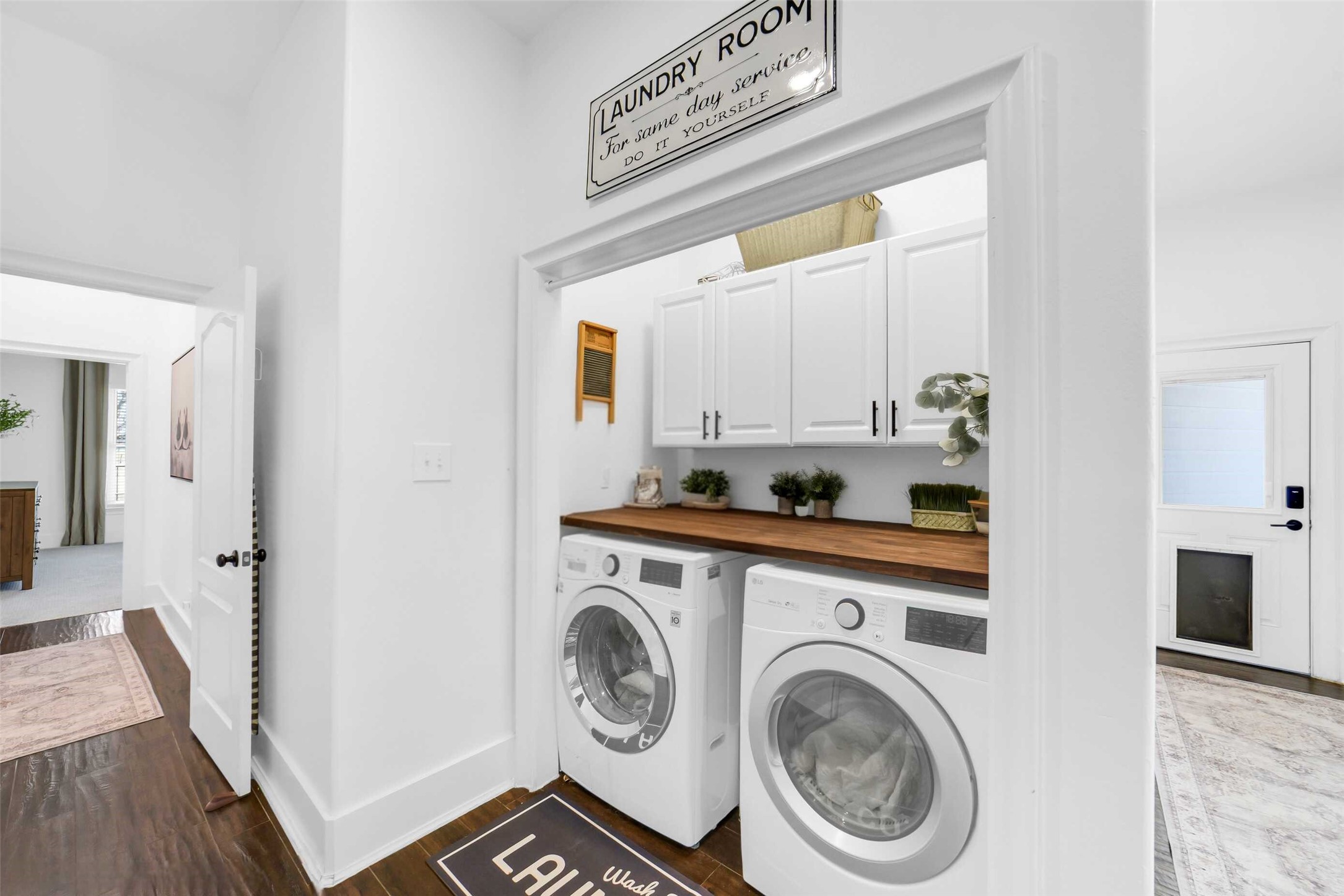3103 Brundrett Road Wallis, TX 77485 - Photo 14 of 50 Laundry area with built-in cabinetry and nearby exterior access.