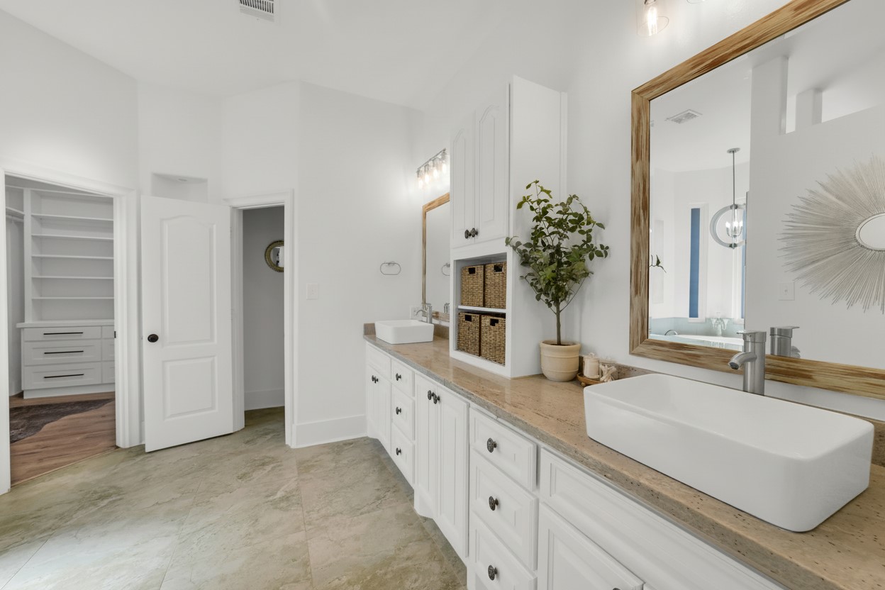 3103 Brundrett Road Wallis, TX 77485 - Photo 22 of 50 Well-appointed primary bathroom with ample counter space and dual sinks.