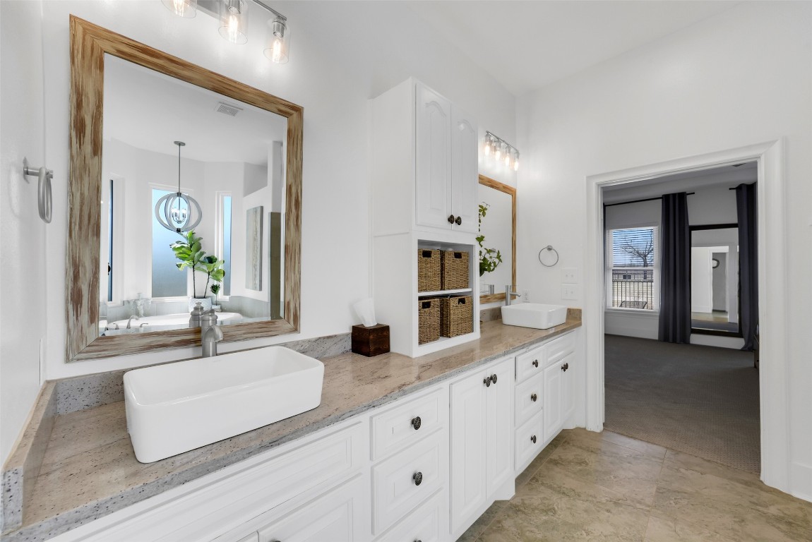 3103 Brundrett Road Wallis, TX 77485 - Photo 23 of 50 a bathroom with double vanity sink and a window