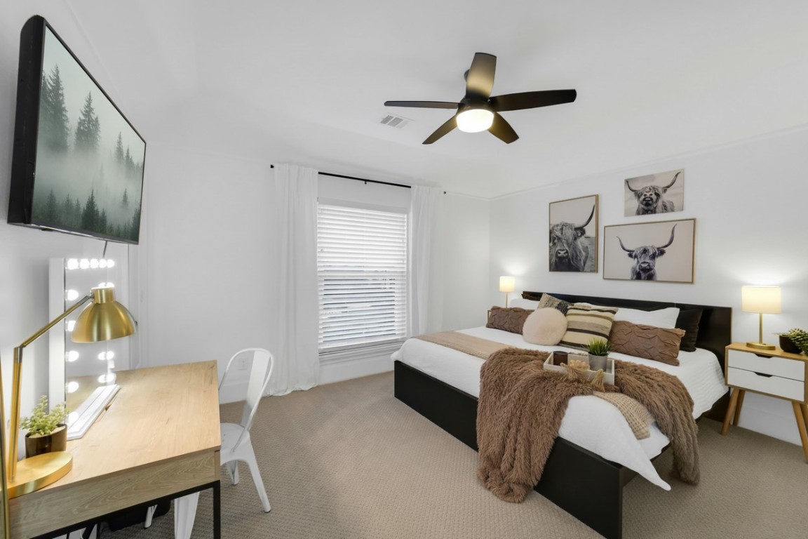 3103 Brundrett Road Wallis, TX 77485 - Photo 29 of 50 a bedroom with a bed a couch and a window