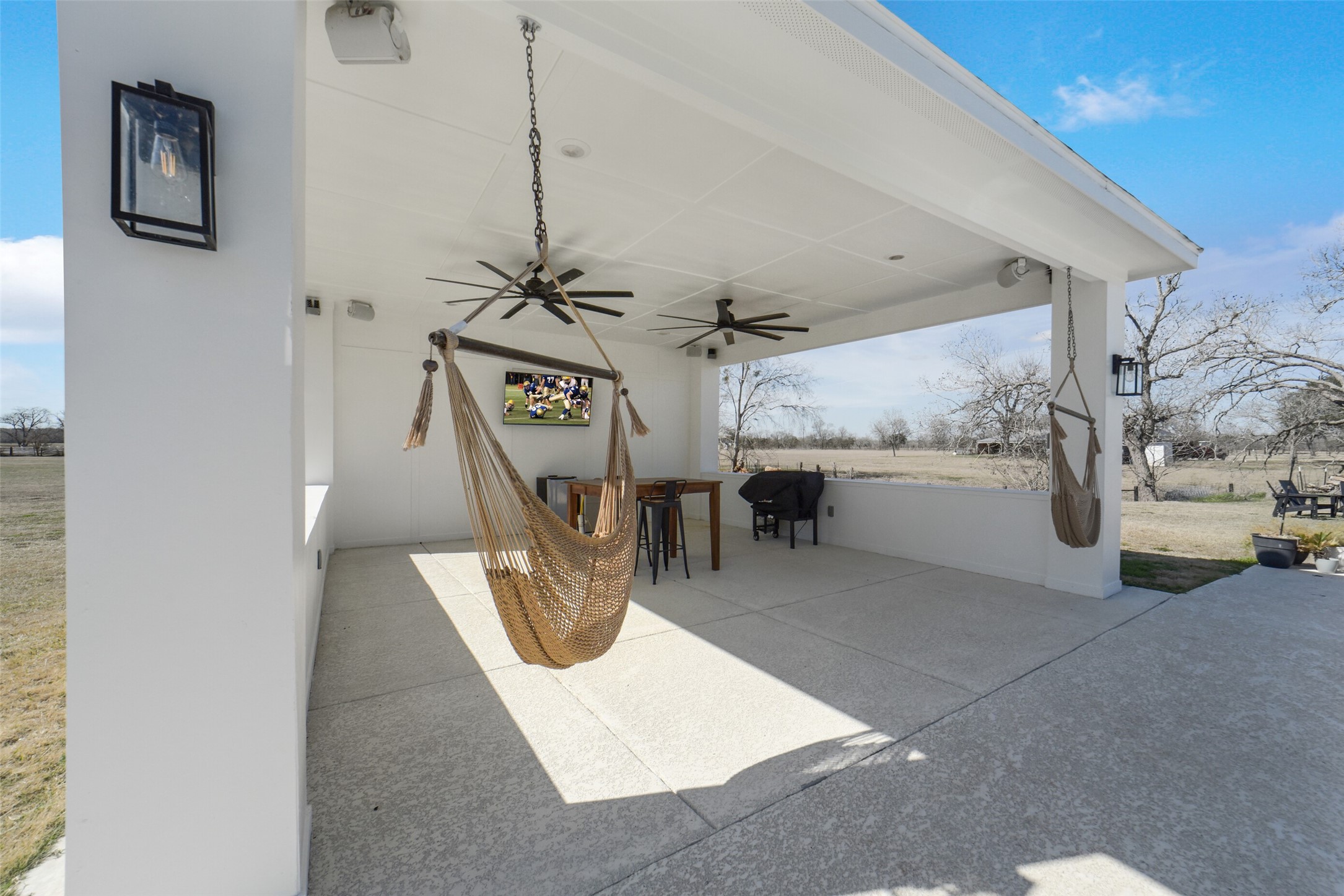 3103 Brundrett Road Wallis, TX 77485 - Photo 35 of 50 Covered patio offering shade, seating, and wide-open views.