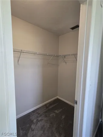 a kitchen with stainless steel appliances a refrigerator sink and microwave