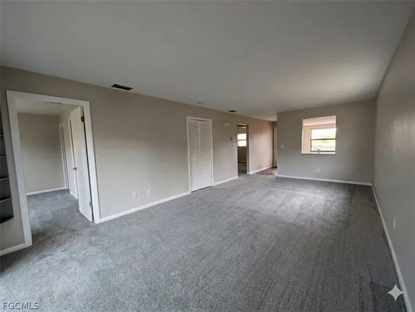 a view of an empty room and window