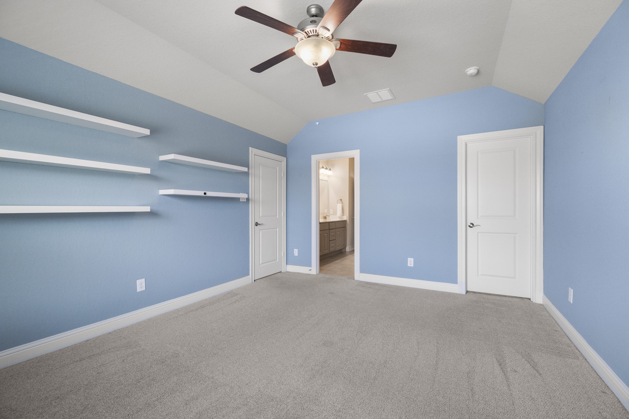 7502 Windsor Park Court Spring, TX 77379 - Photo 33 of 50 a view of an empty room and a ceiling fan