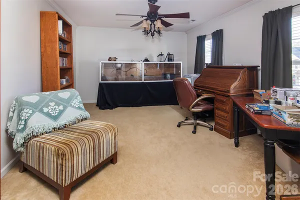 a bedroom with a bed and a desk