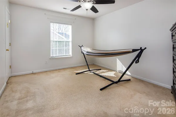 a bench sitting in a room next to a window