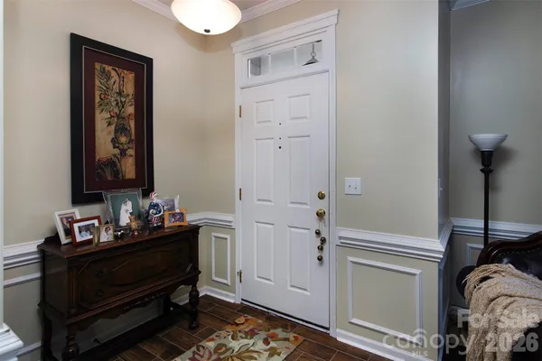 a room that has a bed and a dresser in it