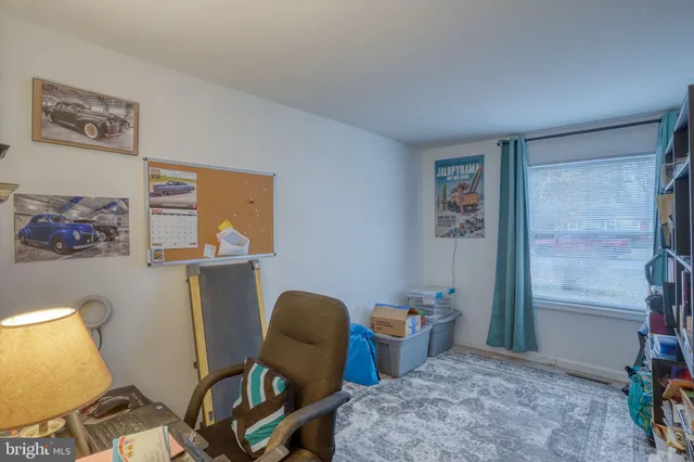 a view of a workspace with furniture and a livingroom