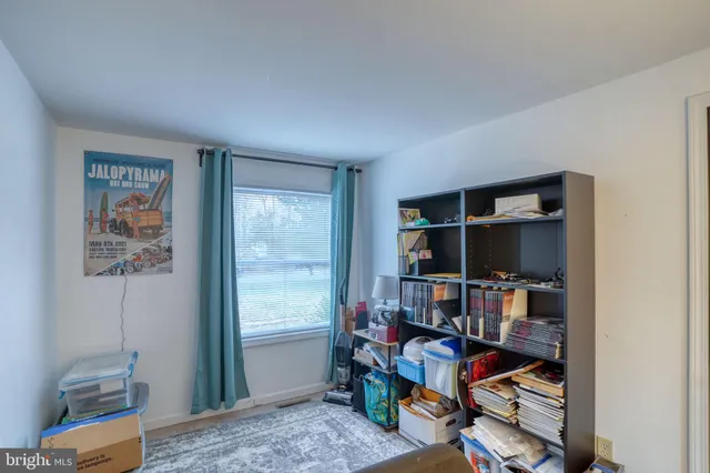 a view of a workspace with furniture and toys
