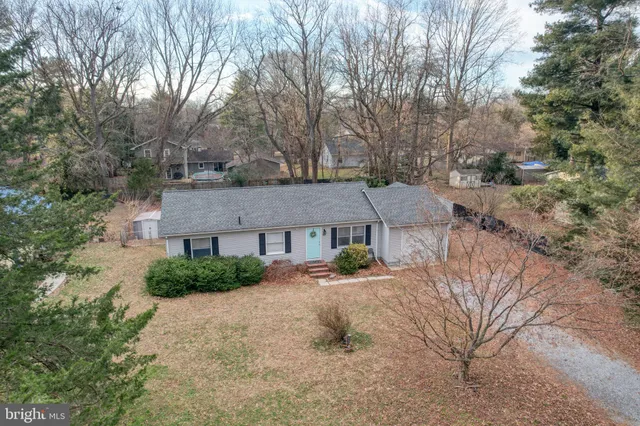 an aerial view of a house with yard swimming pool and outdoor seating