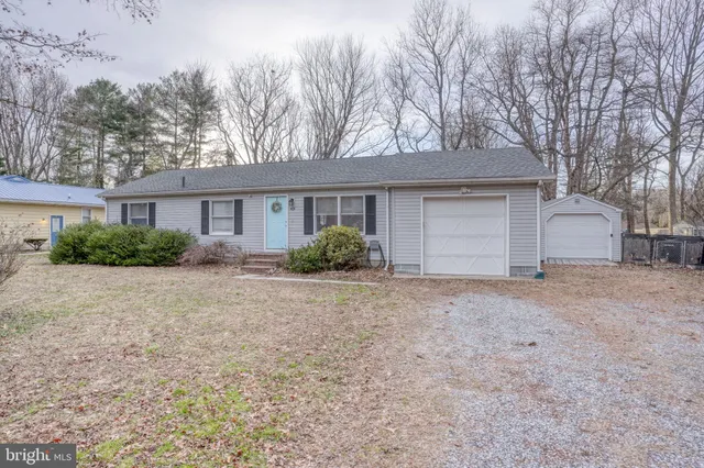 a house with trees in front of it