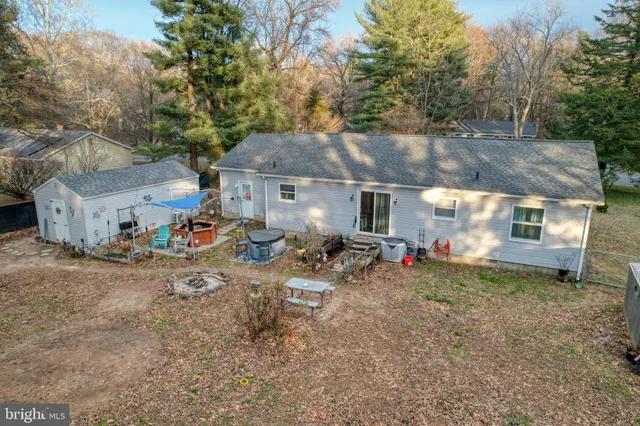 a front view of a house with yard and seating area