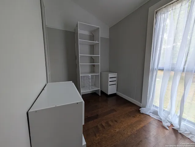 a view of an empty room with a fireplace