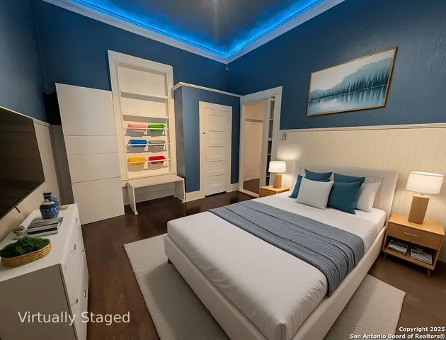 a bedroom with a bed a couch and dresser