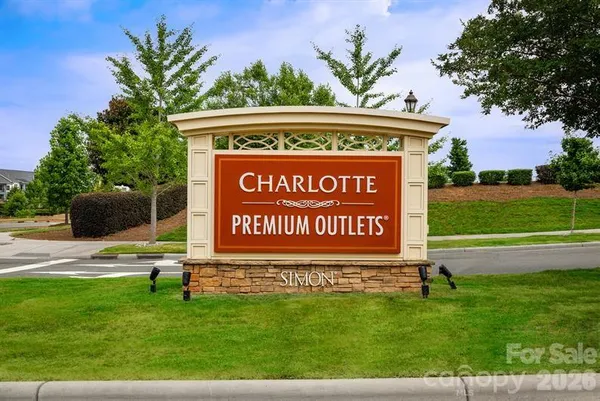 a view of a sign board with a street view