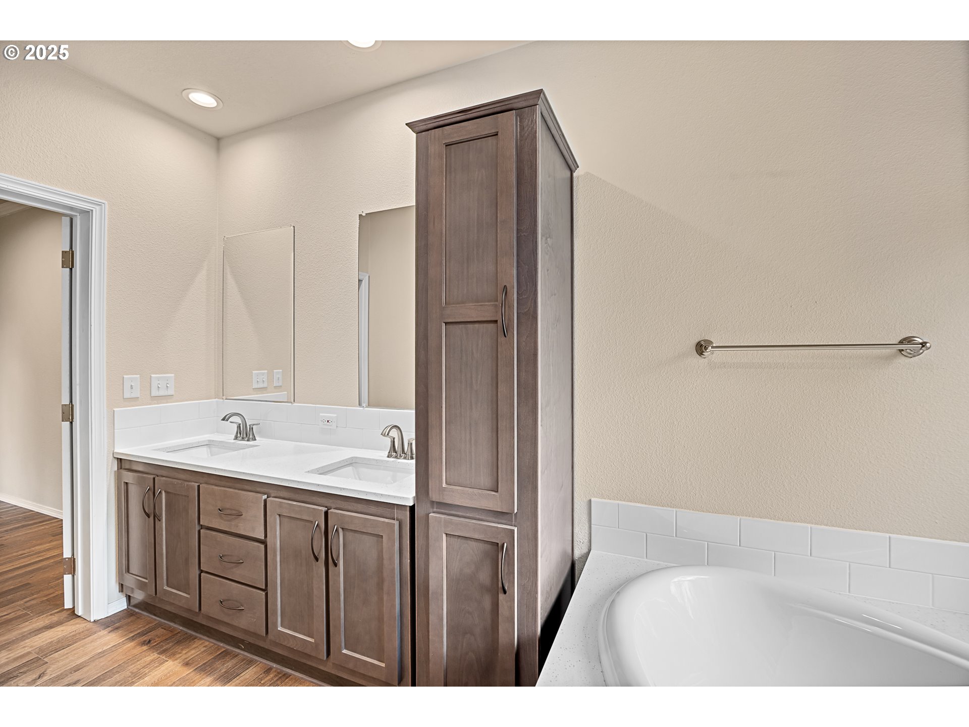352 North Falcon Street Rockaway Beach, OR 97136 - Photo 15 of 32 a bathroom with a granite countertop sink a mirror and a bathtub