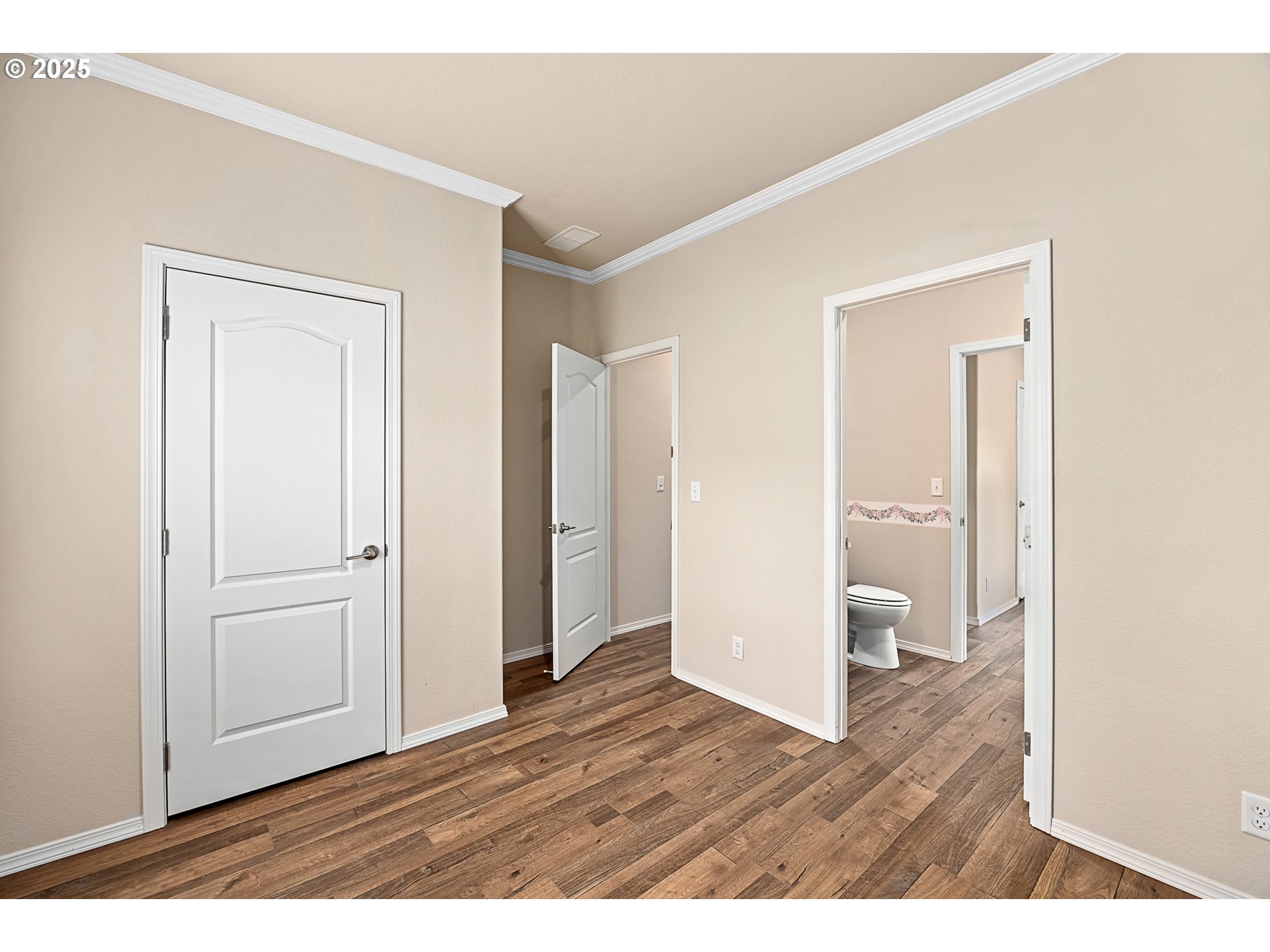 352 North Falcon Street Rockaway Beach, OR 97136 - Photo 20 of 32 a view of an empty room and wooden floor