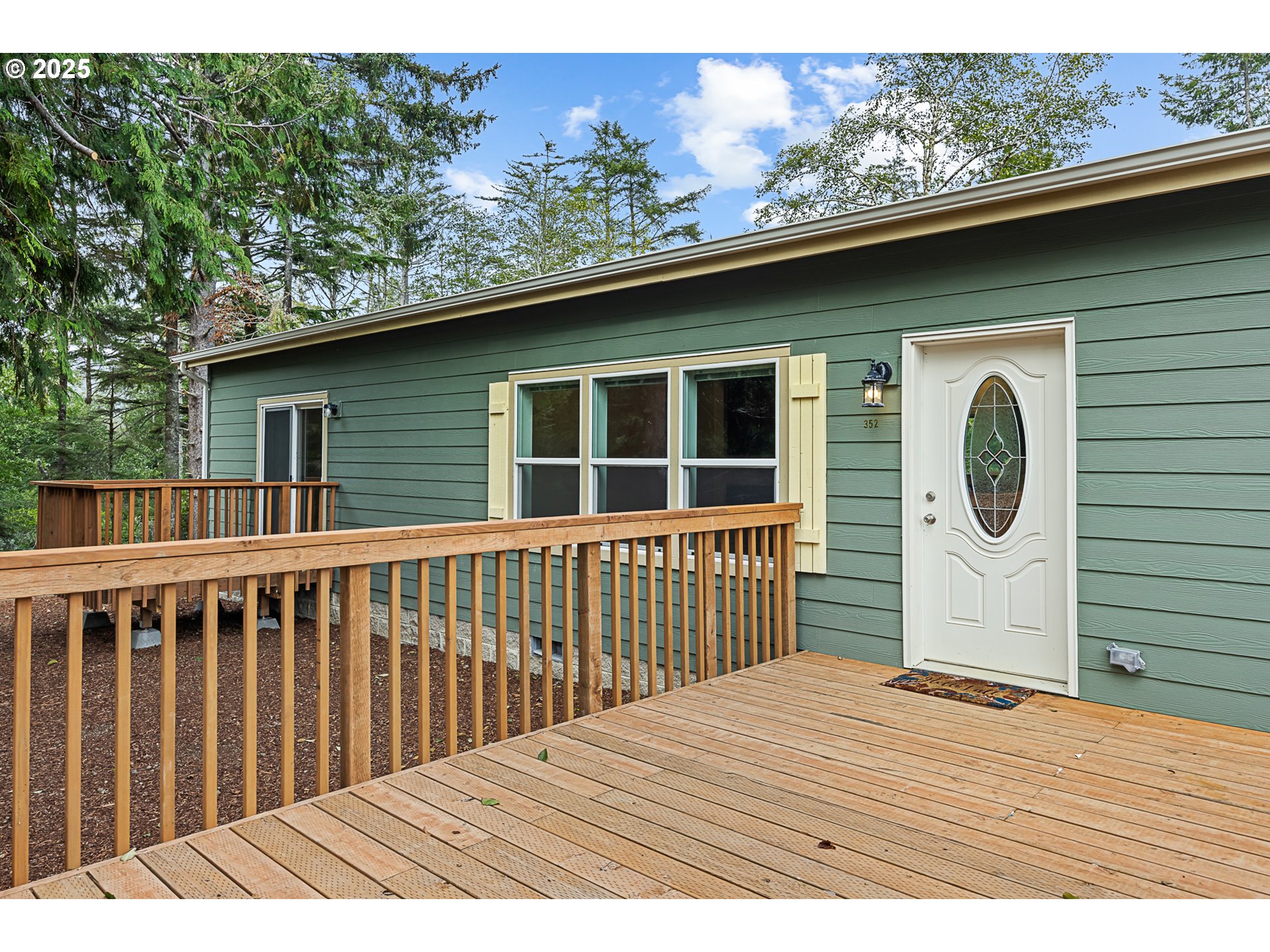 352 North Falcon Street Rockaway Beach, OR 97136 - Photo 2 of 32 a terrace of a house with wooden floor